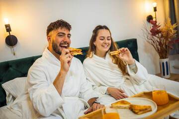 Couple Eating Toast in Bed