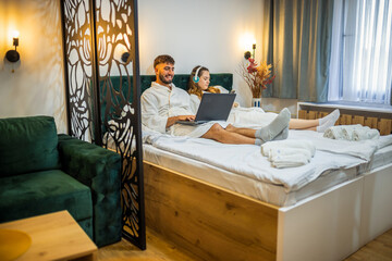 Modern Couple in Bed – Separate Digital Worlds, Shared Space