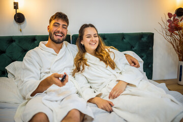 Relaxed Vacation Morning – Couple Watching TV in Bed