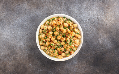 Traditional Lebanese chickpeas with spices, lemon juice, olive oil and parsley Balila or msabaha, served for breakfast