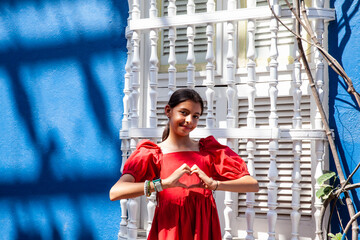 Sweet teenager girl in Cartagena de Indias. Travel concept. Sitting alone. Happy girl.