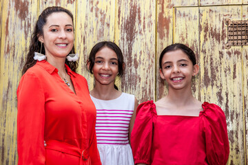 Young mother and her daughters traveling together.  Family love concept. Travel concept. Cartagena de Indias.