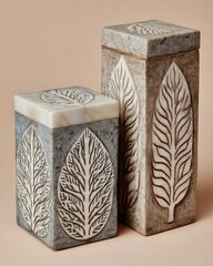 Two stone boxes, rectangular shape, carved leaf design
