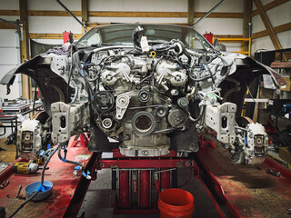 Close-up of an exposed  vehicle Engine in a repair garage