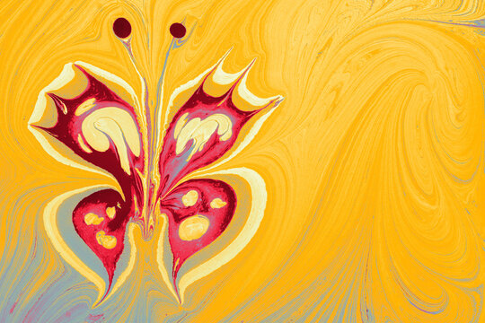Abstract Ebru marbling effect pattern in the shape of a butterfly
