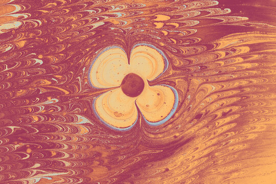 Abstract Ebru marbling effect pattern in the shape of a flower