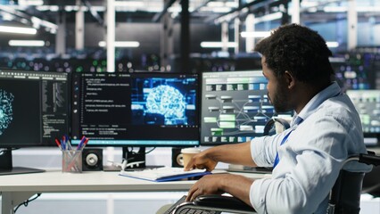 Server hub admin with paraplegia receiving paperwork documents from colleague, using AI node tree software. Man with disability in data center getting documentation files from coworker, camera B
