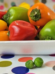Fresh colorful bell peppers on plate