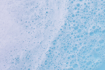 Blue water with white foam bubbles