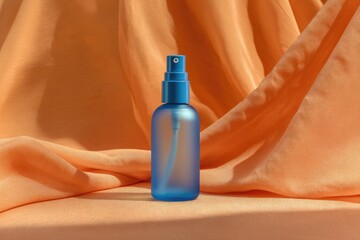 Blue spray bottle on orange fabric