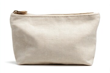 A beige canvas zippered pouch sits isolated casting a soft shadow on a white surface