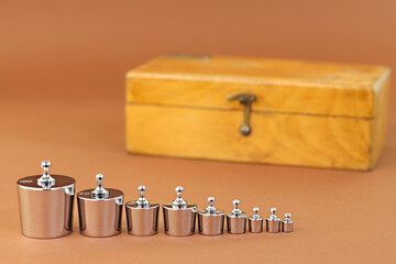 Vintage set of analytical weights and wooden box for their keeping