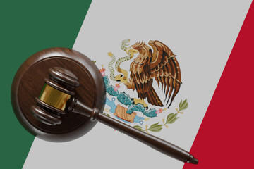 Wooden Gavel Resting on Mexican Flag.
