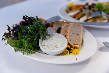 Gourmet Platter with Herb Dressing and a medley of Mixed Greens for a refined meal