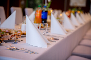 An Elegant and Stylish Dining Setup Featuring Napkins, Beverages, and Decorations