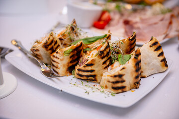 Enjoy a delightful Grilled Flatbread topped with Fresh Ingredients and Garnish to enhance flavor