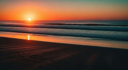 Sunset Over Calm Ocean Waves on Sandy Beach with Warm Orange Sky