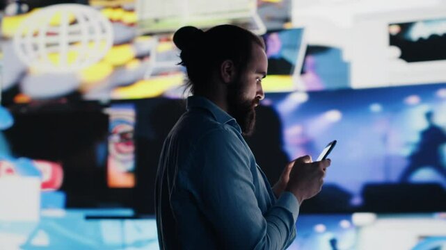 Sleepless obsessed man experiences fear of missing out by social media consumption and obsessive doomscrolling, psychological effects that trigger anxiety and harmful self esteem issues. Camera A.