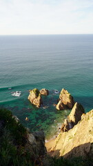 Dramatic coastal rock formations at Praia da Ursa, near Cabo da Roca, Portugal &mdash; Europe's westernmost point, featuring clear waters and stunning seascapes.