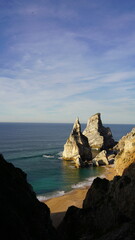 Dramatic coastal rock formations at Praia da Ursa, near Cabo da Roca, Portugal &mdash; Europe's westernmost point, featuring clear waters and stunning seascapes.