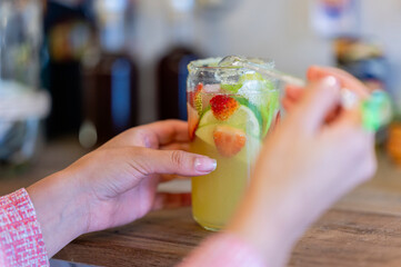 Woman enjoying her summer cocktail