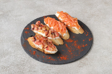 A medium shot of bruschettas with salmon and cream cheese