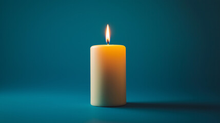 yellow pillar candle on blue background