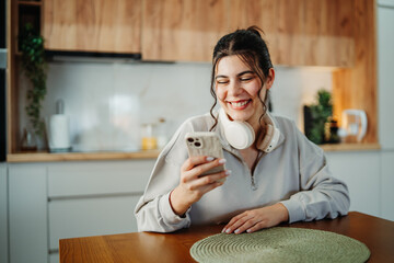 Young caucasian woman using her phone to send text messages sms