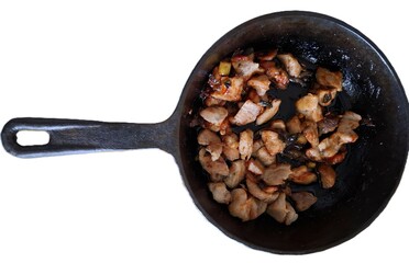 delicious baked meat with green onions and dill in a cast-iron skillet