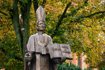 Saint Paulinus of Trier – a bronze statue near the Basilica of St Paulinus in Trier, Germany. "Jesus = Gott + Mensch" [Jesus = God + Man].