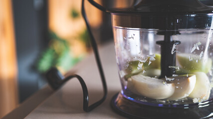 Cooking at home chopping onions food processor chopper