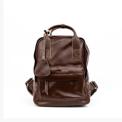 Fototapeta premium Coffee brown leather backpack isolated on white background, perfect for leather products catalog design