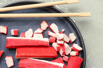 Plate with tasty crab sticks on light background, closeup © Pixel-Shot