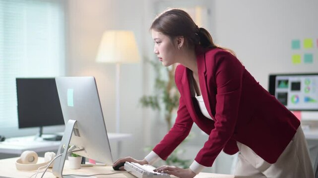 Businesswoman working with bad posture at computer