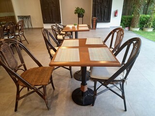 Wooden tables and chairs neatly arranged in the dining room