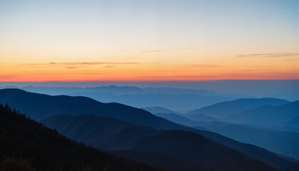 Obraz premium Mountain range at sunset with layered silhouettes