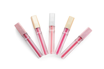 Beautiful liquid pink lipsticks in different shades on white background