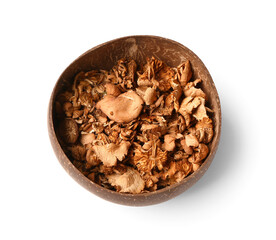 Brown bowl with tasty dried mushrooms on white background