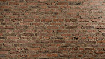 close up detailed view of an old rustic brick wall with weathered textures and earthy shades
