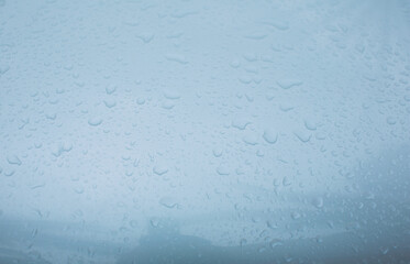 Raindrops cling to the shiny metal surface.