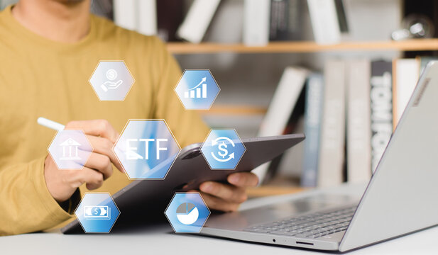 ETF Exchange traded fund stock market trading investment financial concept, Businessman using smartphone with icons of ETF on vr screen.