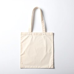 A stylish white tote bag with sturdy handles rests elegantly on a soft grey background, highlighting its minimalist design and versatile appeal.