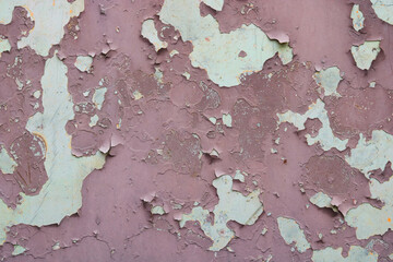An old outside door with peeling paint.