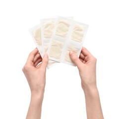 Woman holding mustard plasters on white background