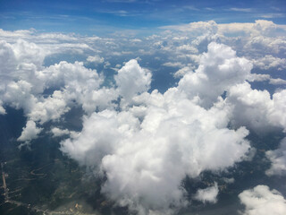 Aerial View of White Clouds in Blue Sky Above Earth – Scenic Atmospheric Landscape from Above