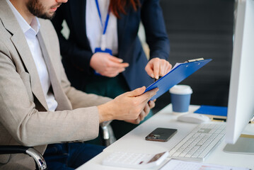 Businessman and team analyzing financial statement Finance task. with smart phone and laptop