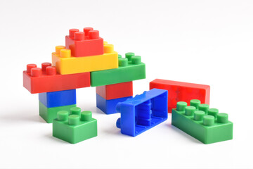 Obraz premium Plastic building blocks isolated on white background