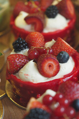 Delicious dessert with fresh berries and cream topping