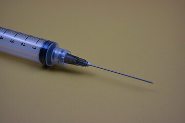 Close-Up of a Medical Syringe Needle on a Plain Background
