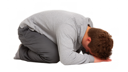Depressed man kneeling on the floor with his head down, expressing feelings of sadness, desperation, and hopelessness, isolated on transparent background